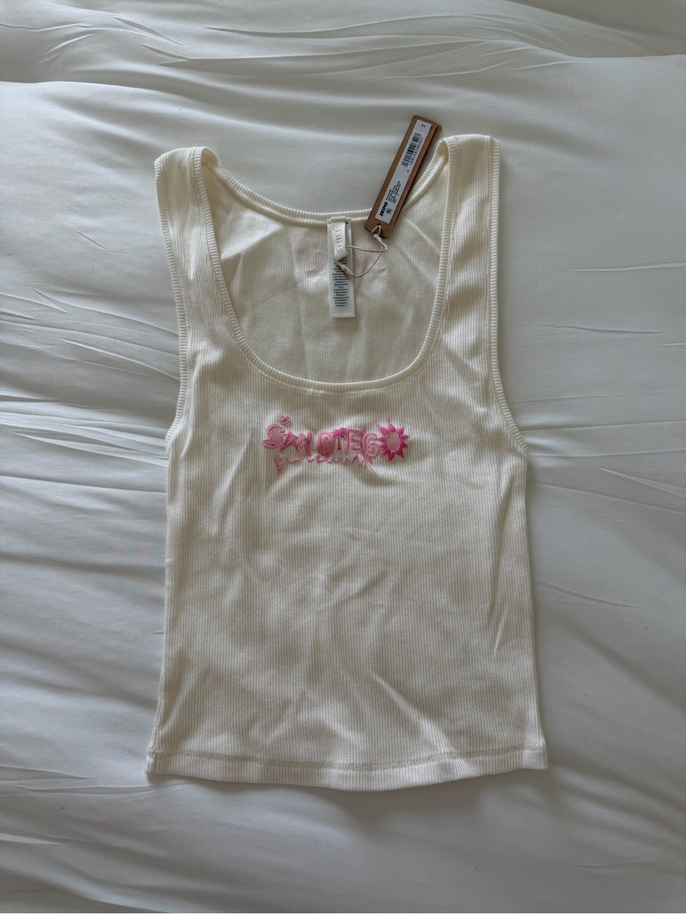 SKIMS Cream Ribbed Tank with Pink Floral Logo